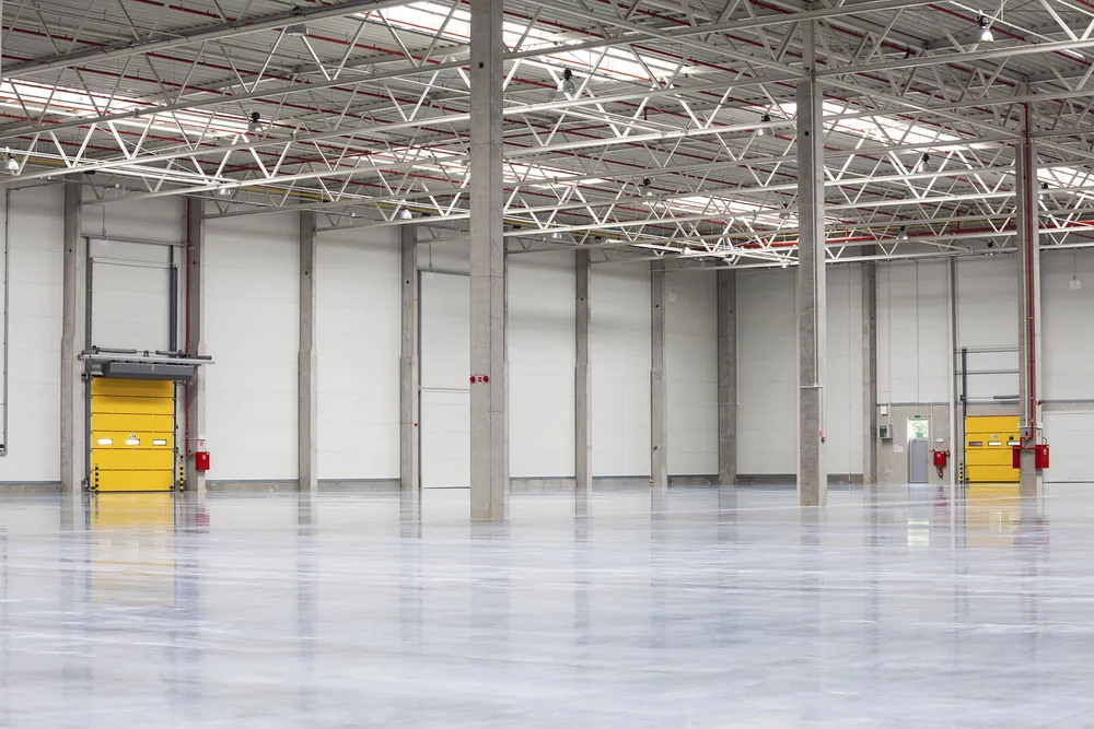 a large empty warehouse with white walls